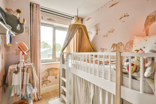 Interior of modern kid bedroom with bed and shelves with various toys at home