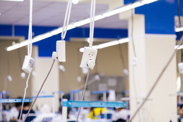 Electrical wiring for sewing machines in a sewing workshop