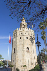 Fototapeta na wymiar Bottom view of Golden tower or Torre del Oro, a medieval military control tower on riverside of Seville, Andalusia, Spain.
