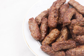 Grilled Kebabs served on the plate with copy space above white background
