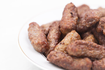 Grilled Kebabs served on the plate with copy space above white background