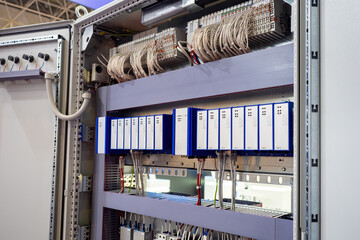 Cabinet with electrical equipment. Distributed electrical equipment. Metal cabinet with many wires and machines. Equipment for electrification in industrial premises. Electrical networks