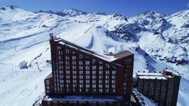 Panoramic view of Ski station centre resort at snowy Andes Mountains near Santiago Chile. Snow mountain landscape. Nevada mountains. Winter travel destination. Winter tourism travel.