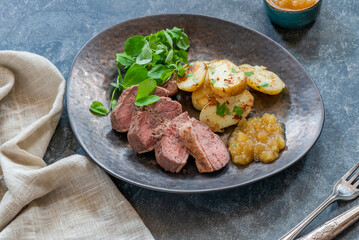 Roasted dack breast with fried potatoes and apple sauce