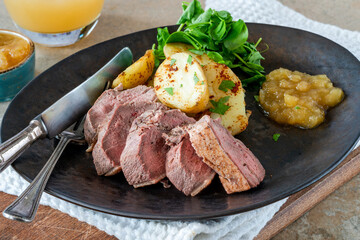 Roasted dack breast with fried potatoes and apple sauce