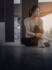 Negative emotions. Full length of young Asian woman sitting with dull or thoughtful face expression, feeling upset or tired, having problem or depression