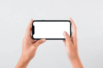 Hand holding smartphone mockup device touching screen on white backgrounds