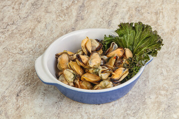 Tasty marinated mussels in the bowl