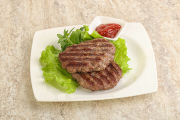Grilled beef burger cutlet with sauce