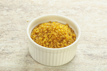 Raw bulgur in the bowl