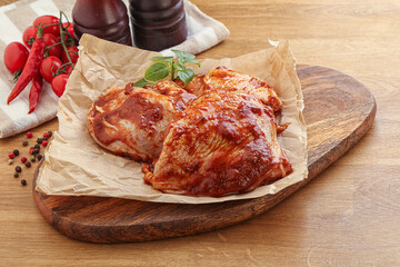 Marinated chicken leg in tomato sauce