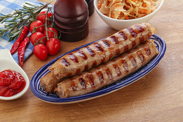 Grilled sausages with cabbage and sauce