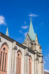 Fototapeta na wymiar Towers of the historic Gertrud church in Essen, Germany