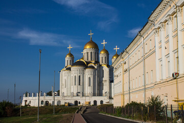 Vladimir, Russia - August, 17, 2022: the ancient white-stone Assumption Cathedral with shining...