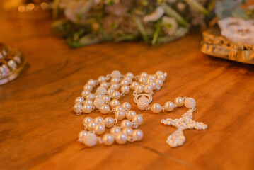 bride's rosary on the table at wedding reception
