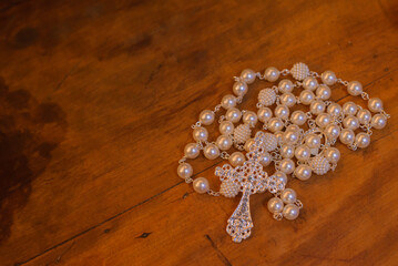 bride's rosary on the table at wedding reception