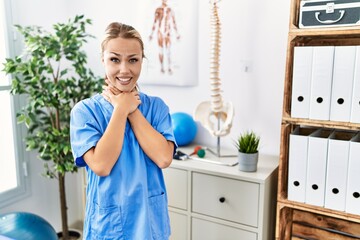 Young caucasian woman working at pain recovery clinic shouting and suffocate because painful strangle. health problem. asphyxiate and suicide concept.