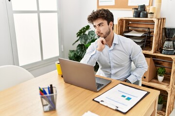 Young hispanic businessman concentrate working at the office.
