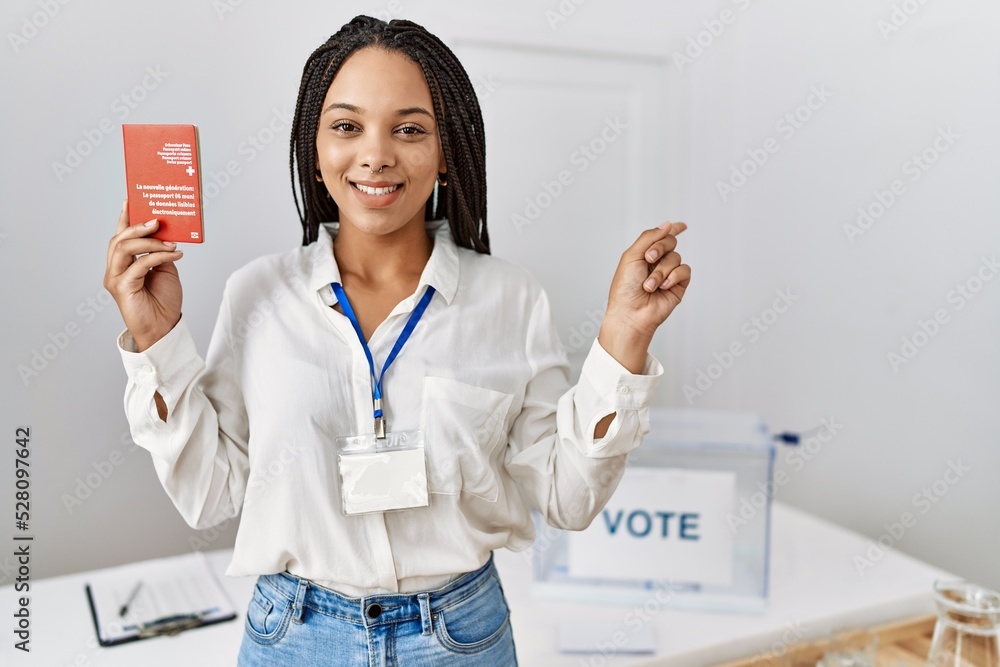 Poster young african american woman at political campaign election holding swiss passport smiling happy poi