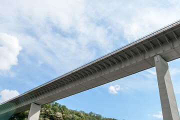 High bridge across the river. bottom view against blue sky