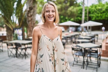 Young beautiful woman smiling confident outdoor