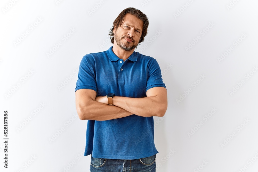 Canvas Prints Handsome middle age man standing together over isolated background skeptic and nervous, disapproving expression on face with crossed arms. negative person.