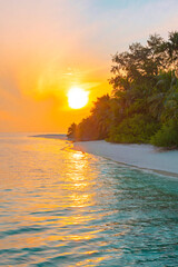 Fototapeta na wymiar picturesque sunrise in the Maldives island, the sun rising from the Indian ocean and reflected in the water, travel concept