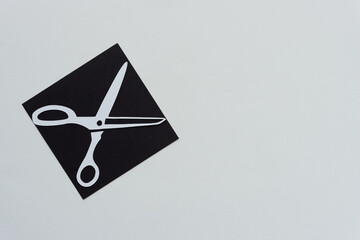 stencil with scissors shape on blank paper