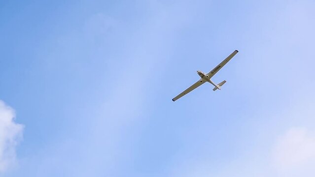 G-CDNA Grob G-109B (Army Gliding Association) a low wing two-seat self-launching motor glider flying in a blue sky, Wiltshire UK