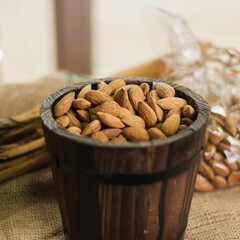 Almonds closeup on wooden bowl 