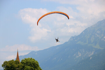 Paragliders in Interlaken, Switzerland in Interlaken, Switzerland. Interlaken is famous resort in...