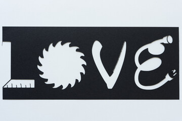 the word love represented with paper (stencil with fancy font)