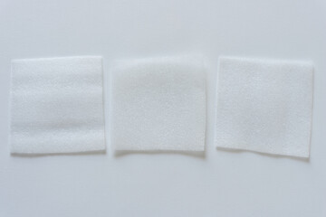 three foam squares on blank paper