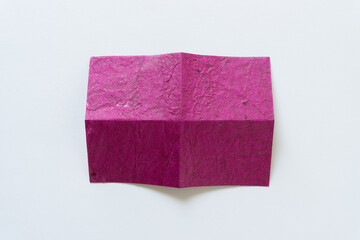 pink card stock folded in quarters