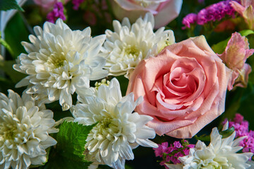 Bouquet of flowers of roses, chrysanthemums close-up. Natural background.