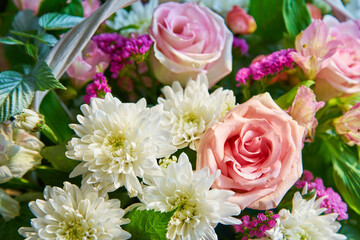 Bouquet of flowers of roses, chrysanthemums close-up. Natural background.