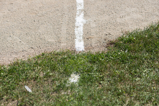 line in the sand (and grass) at a baseball diamond
