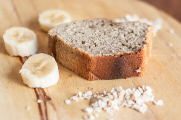 Banana and oat bread served on a wooden tray. Vegan, healthy, fresh.