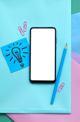 Smartphone mock up template mobile phone screen isolated on school pastel trendy background flat lay, top view. New ideas concept. Online education, elearning app, remote classes applications. Mockup