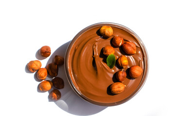 Liquid chocolate, hazelnut isolated on white background