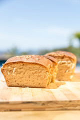Homemade bread with sesame seeds on a wooden board. Vegan