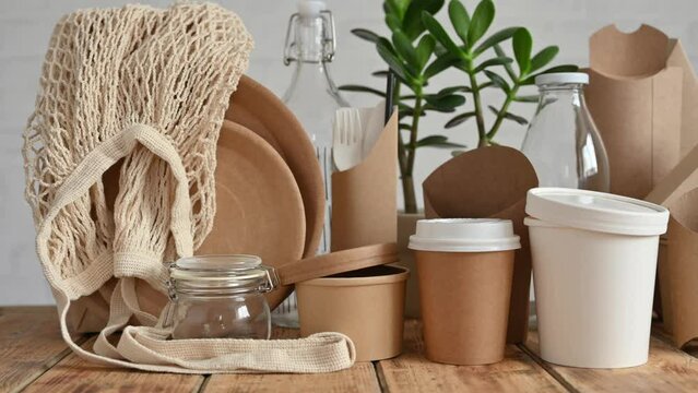 Zero waste concept. Camera movement along eco-friendly paper tableware and packaging made from natural biodegradable materials.