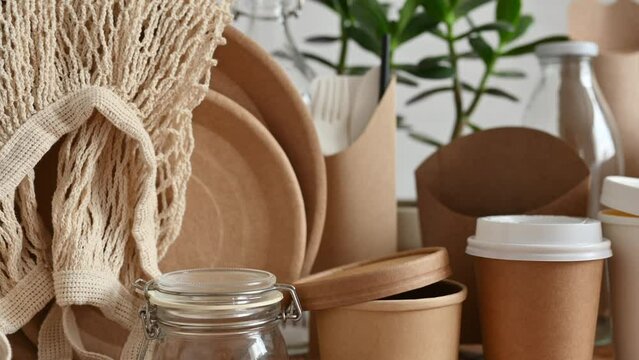 Paper eco-friendly tableware and packaging. Slow camera movement. The concept of using natural biodegradable materials. Selective focus to foreground