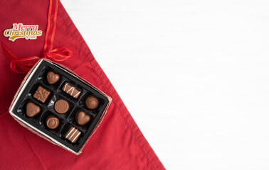 Box of Chocolates As a Christmas Gift Open on Table with Copy Space