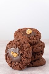 Stack of New Zealand Chocolate Afghan Cookies on Table with Copy Space Vertical