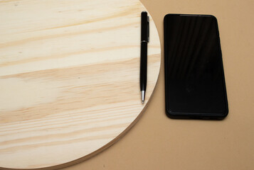 smartphone and pen on the office table