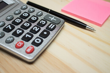 super close calculator near notepad - office