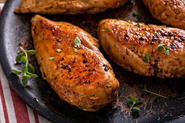 Roasted or seared chicken breast with herbs - obrazy, fototapety, plakaty
