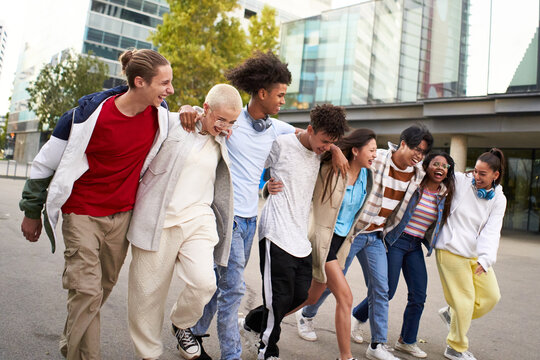 Multiracial friends group portrait outside. Happy multi cultural people smiling outdoors. College students, friendship and community concept