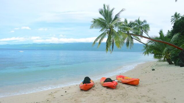 Kayaks on tropical beach